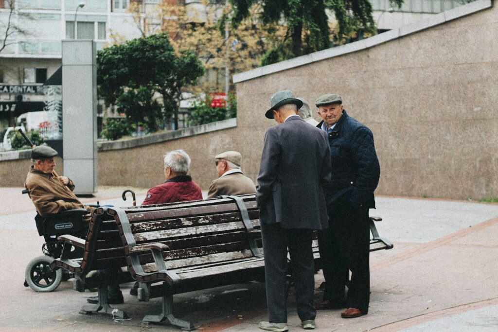 Photo by Thiago Barletta man sitting on bench